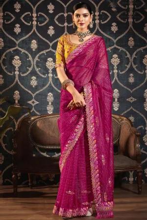 Dazzling Border Work On Rani Color Saree In Organza Fabric