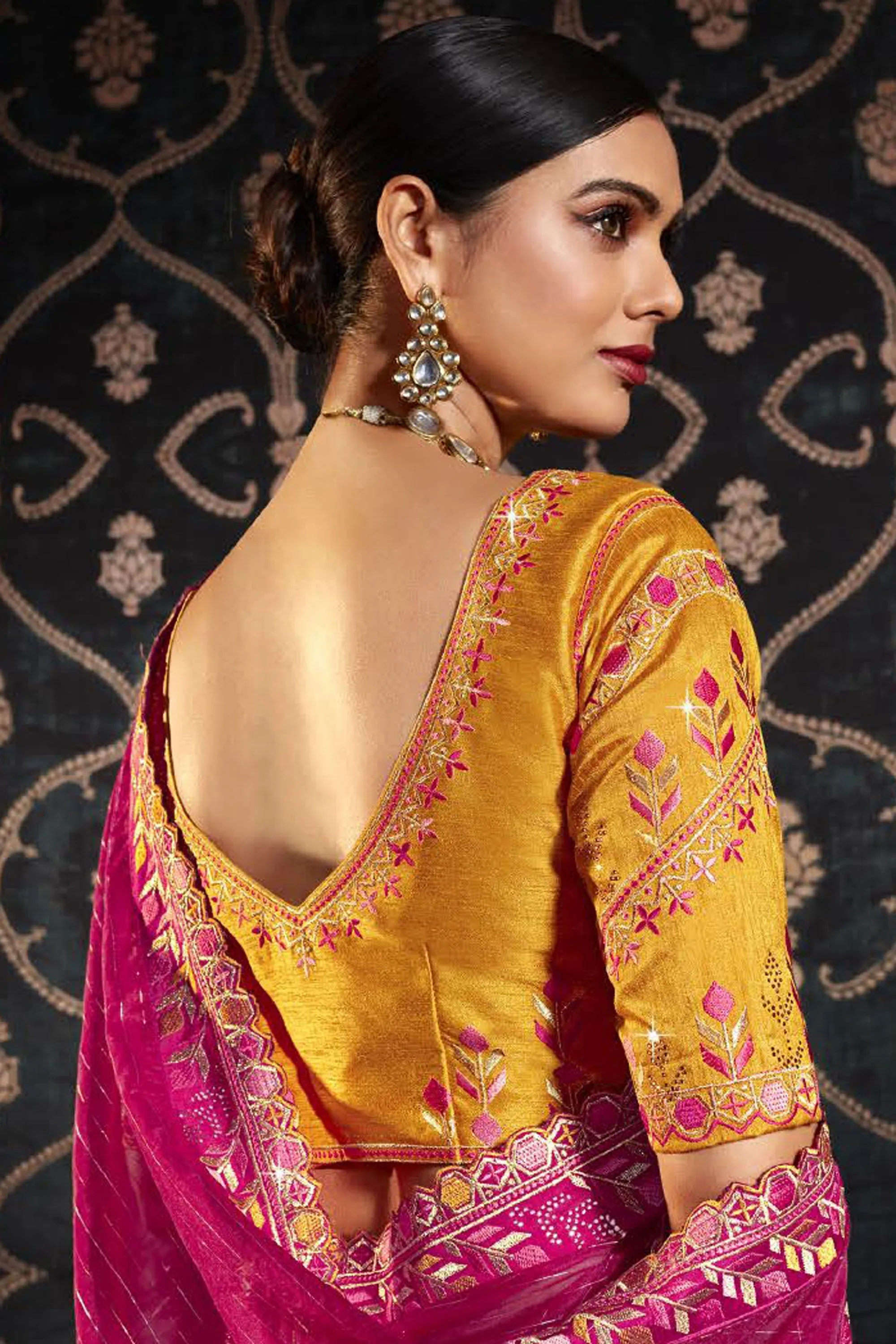 Dazzling Border Work On Rani Color Saree In Organza Fabric