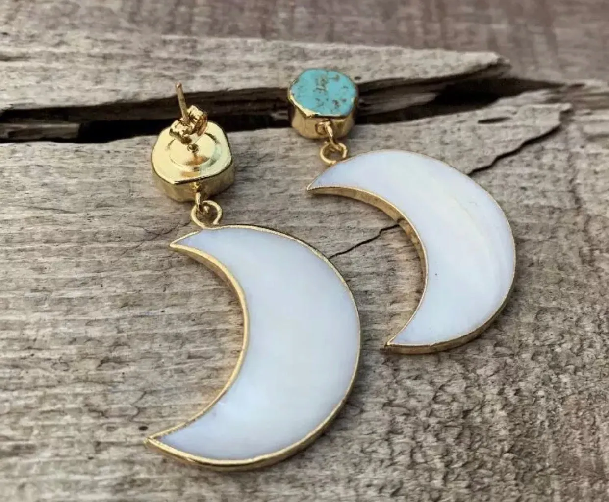 Gorgeous mother of Pearl crescent moon earrings dipped in gold, with raw turquoise.