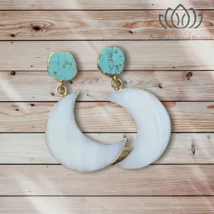Gorgeous mother of Pearl crescent moon earrings dipped in gold, with raw turquoise.