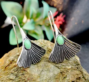 Handmade unique vintage style green stone inlaid dangle earrings.